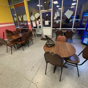 an empty restaurant with tables and chairs