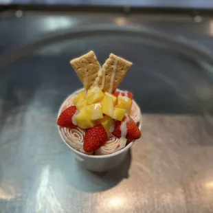 a bowl of fruit and crackers
