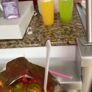 Hot Cheetos with nacho cheese and jalapeños, pineapple water, and half cucumber/half lime water (: