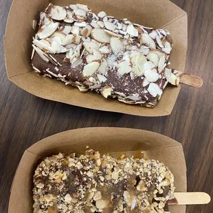 Paletas with chocolate and nut toppings.