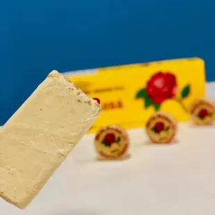 a hand holding a piece of ice cream