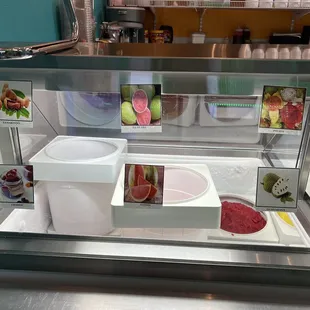 a display case with food items