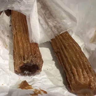 Freshly made Churros. Comes in a bag of 3-I ordered one of each-Chocolate, Strawberry and Cajeta syrup.