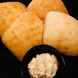 Fresh and soft dinner rolls with whipped honey butter spread.