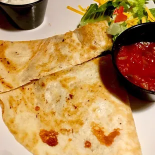 A half eaten Chicken Quesadilla appetizer. I forgot to post a pic before our chow down.