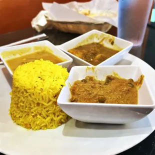 a plate of food with rice and curry