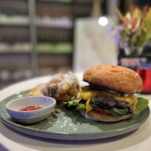 a hamburger and fries on a plate