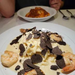 Cheese wheel pasta with shaved truffle and shrimp