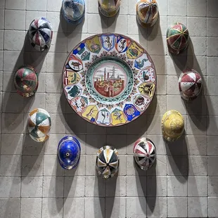 Dish and hats on the wall.