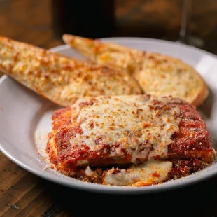 a plate of pizza and bread