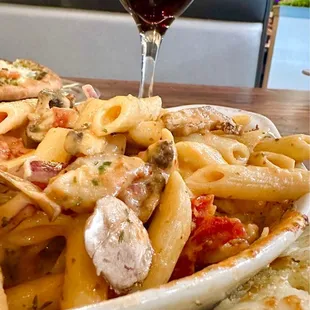 Pic 2: Pasta Arrabbiata w/ Sausage, Rstd. Chicken, Mushrooms, Red Onions, Sun-dried Tomatoes in a Zesty Tomato Cream Sauce.