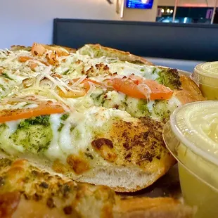 Greek Bread made with Basil Pesto, Tomato. &amp; Feta Cheese.