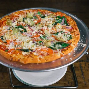 a pizza on a silver platter