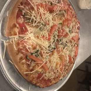 a pizza with tomatoes and cheese