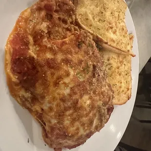 a plate of pizza and bread