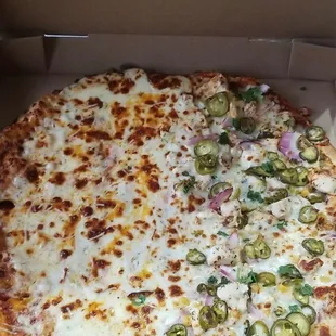 Half Quattro Formaggio Pizza and half Scorcher Pizza