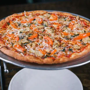 a pizza on a silver platter