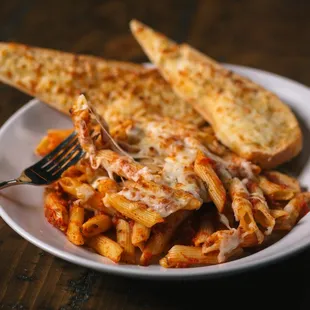 a plate of pasta and bread