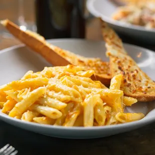 a plate of pasta and toast