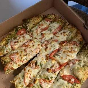Yummy green Greek Bread. Pesto spices and veggies. Light yet tasty.