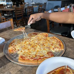 Cheese pull on one of the smallest pieces! It was great pizza!