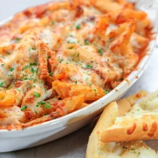 a casserole dish of pasta and bread