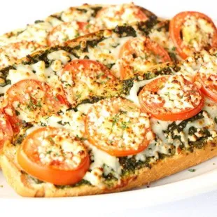 a pizza with tomatoes and cheese