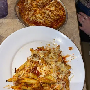 Lunch baked ziti w meat sauce and lunch pepperoni and roasted garlic pizza. Cheese bread was included with the ziti but it was devoured