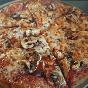 Small whole wheat pizza with pepperoni, mushrooms and garlic.