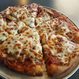 Lunch special size pizza with up to 3 toppings. I chose double pep and olives.