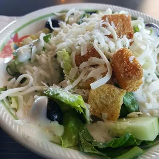 Salad that comes with lunch special, minus tomatoes and added cheese.