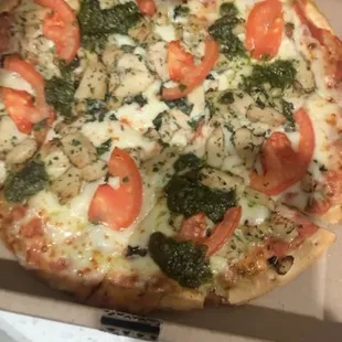 Margarita chicken pesto pizza on cauliflower crust