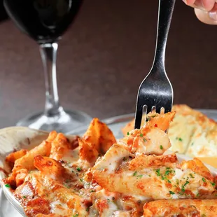 a plate of food and a glass of wine