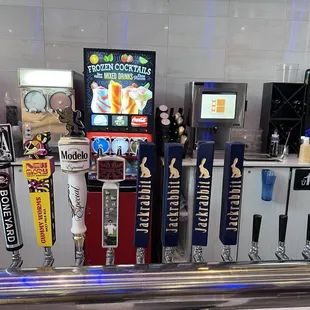 Beers on tap as well as frozen cocktails in the back.