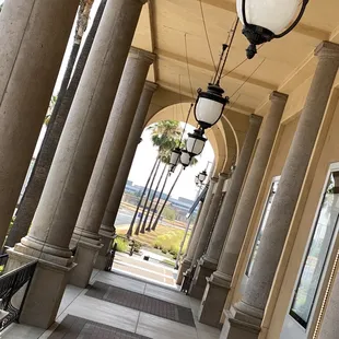 a row of columns and lamps
