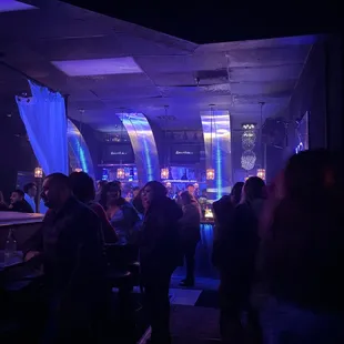 a crowd of people at a bar