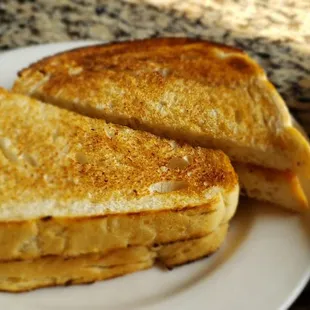 a plate of grilled cheese sandwiches