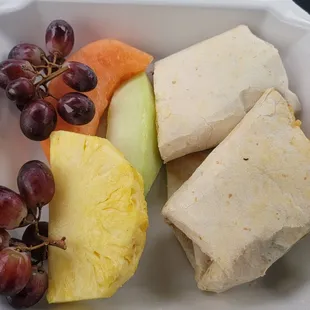 Bacon, egg, and cheese burrito with fruit