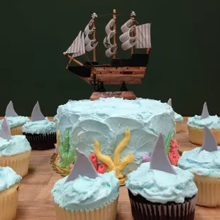 a cupcake with a pirate ship on top