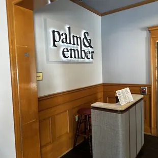the front desk of the palm and ember office