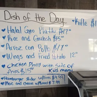 a white board with a list of dishes on it