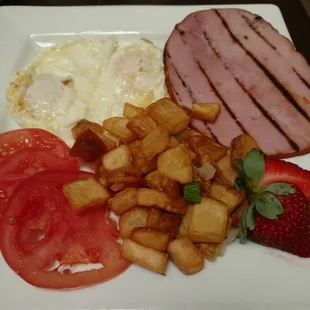 Ham steak and eggs sub toast for tomato slices.  Yummy!