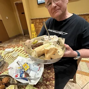 Hot sausage New Orleans style po'boy sandwich and creamy coleslaw.