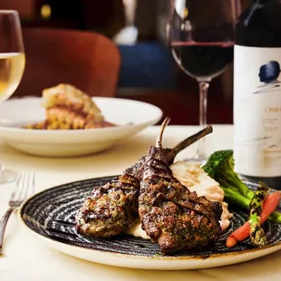 a plate of food and a glass of wine
