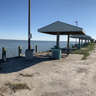 Along the sea wall. In front of roll A.