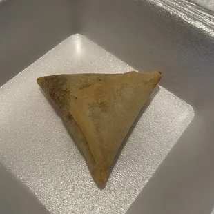 a triangular pastry in a container