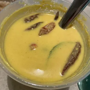 a bowl of soup with a spoon in it