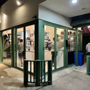 the outside of a restaurant at night