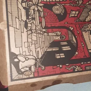 a pizza box with a drawing on it