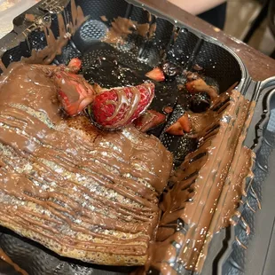 a chocolate crepe with strawberries
